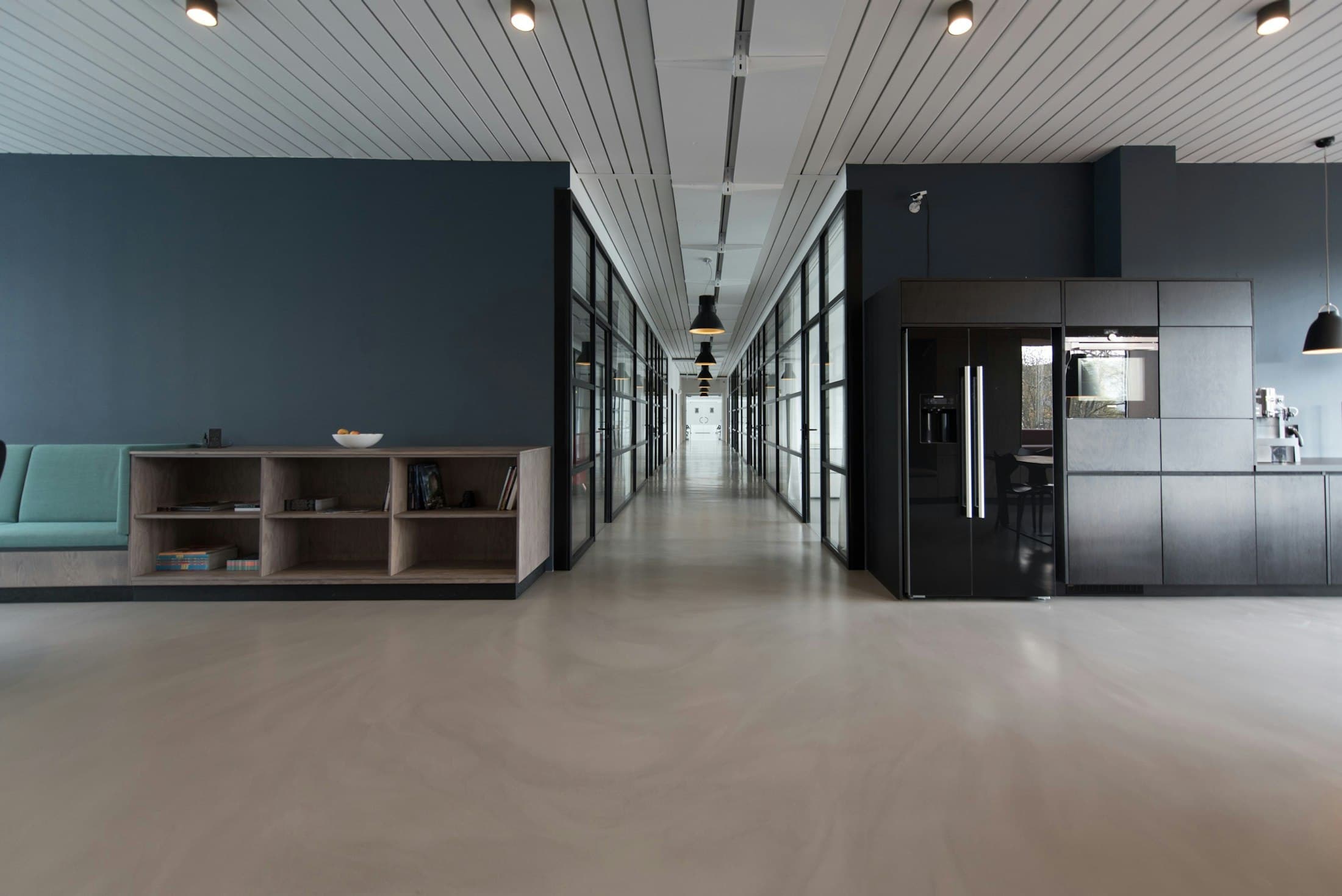 Quiet office corridor used as a visual metaphor for research progression.
